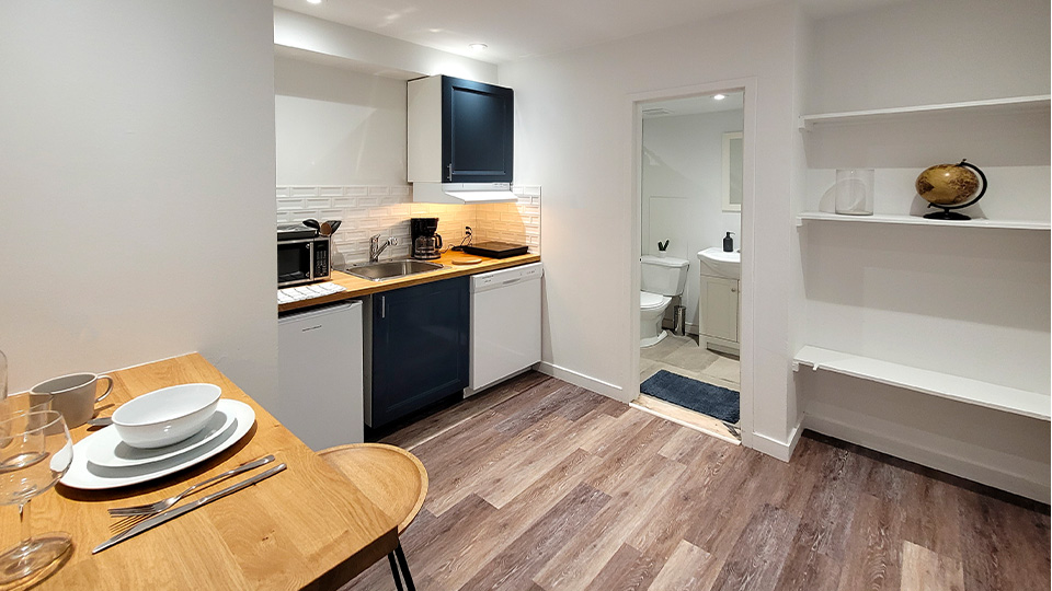 kitchen and door to bathroom of furnished apartments in Montreal